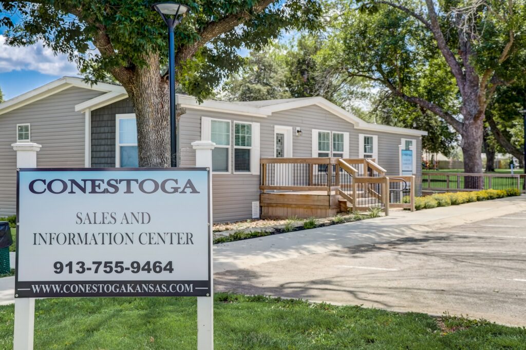 Conestoga Sales and Information Center sign in front of manufactured home community office in Gardner, Kansas